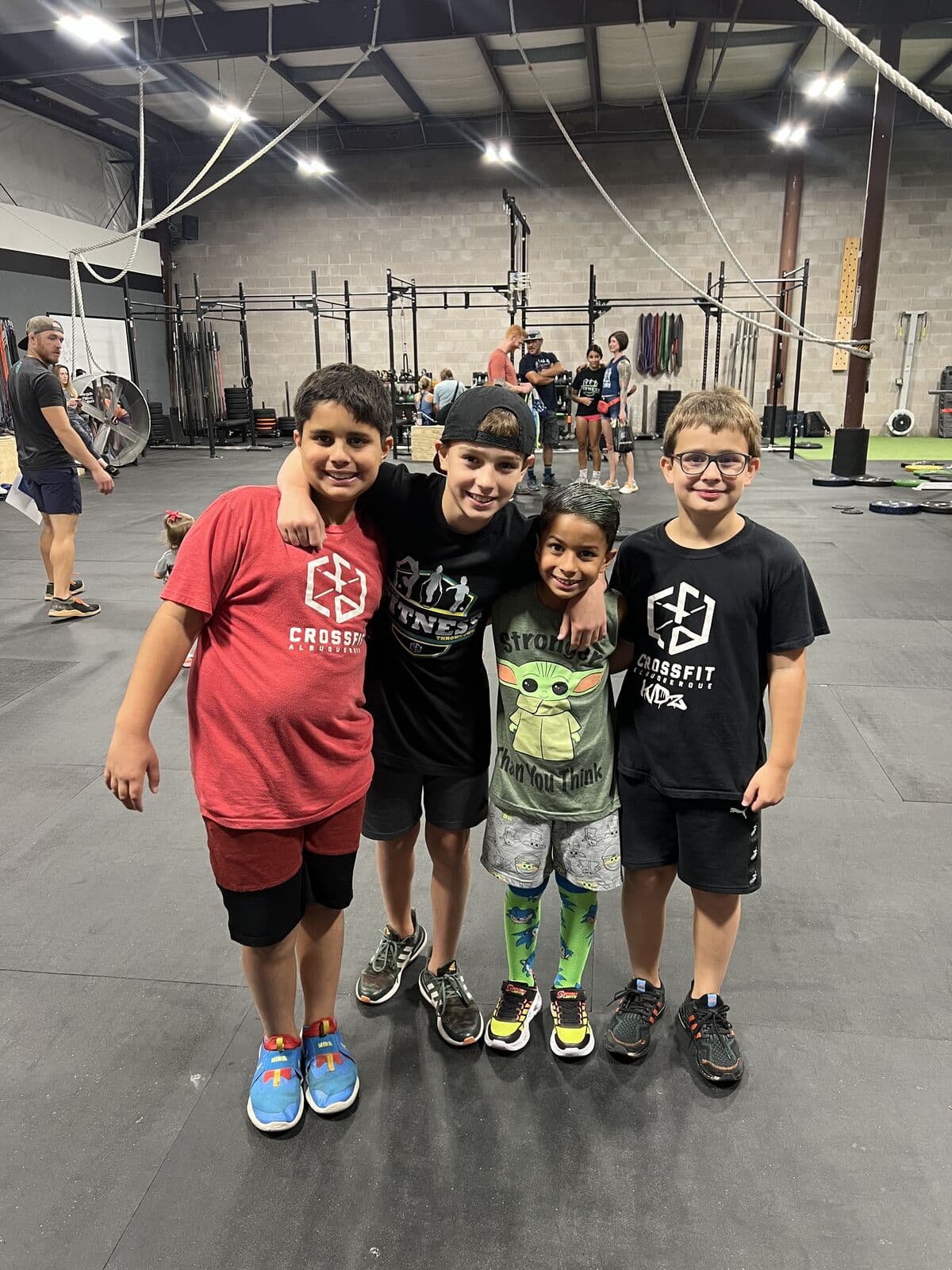 Four CrossFit Kids members on the gym floor at CrossFit Albuquerque